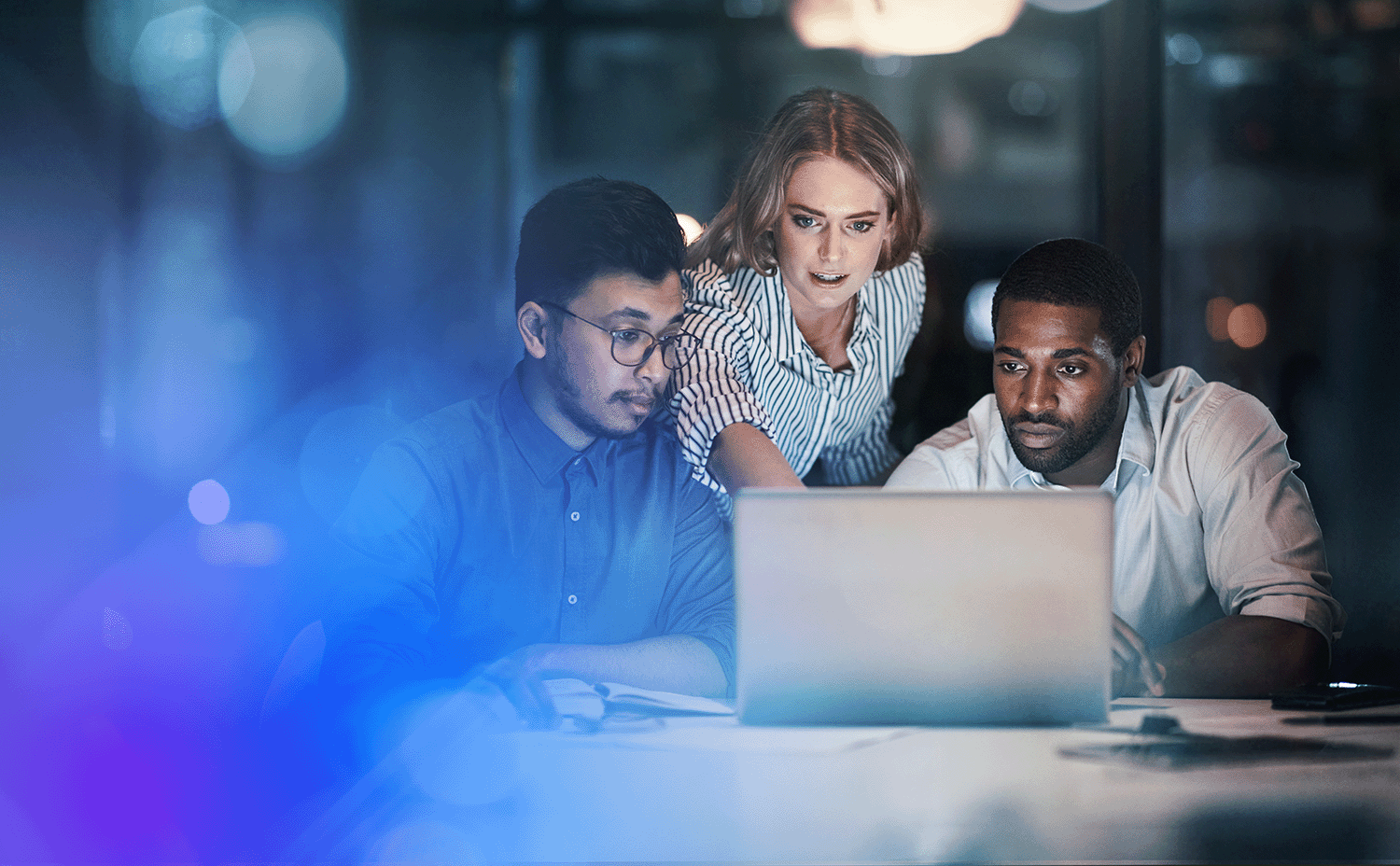 three-people-looking-at-computer-screen-gradient-1500