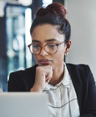 Women concentrating at laptop